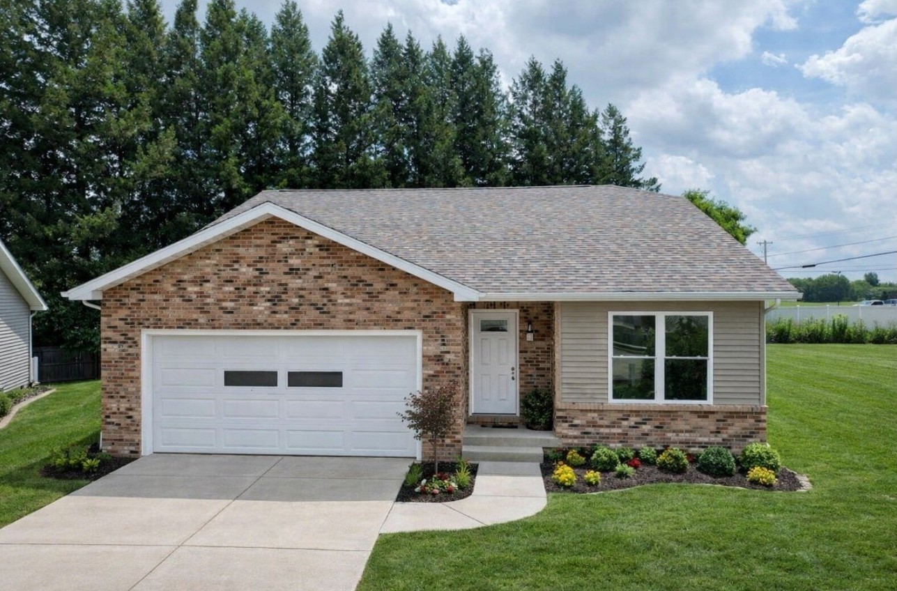 74 Prince William Court, a ranch-style home with brick front and two-car garage in Whispering Meadows, La Porte