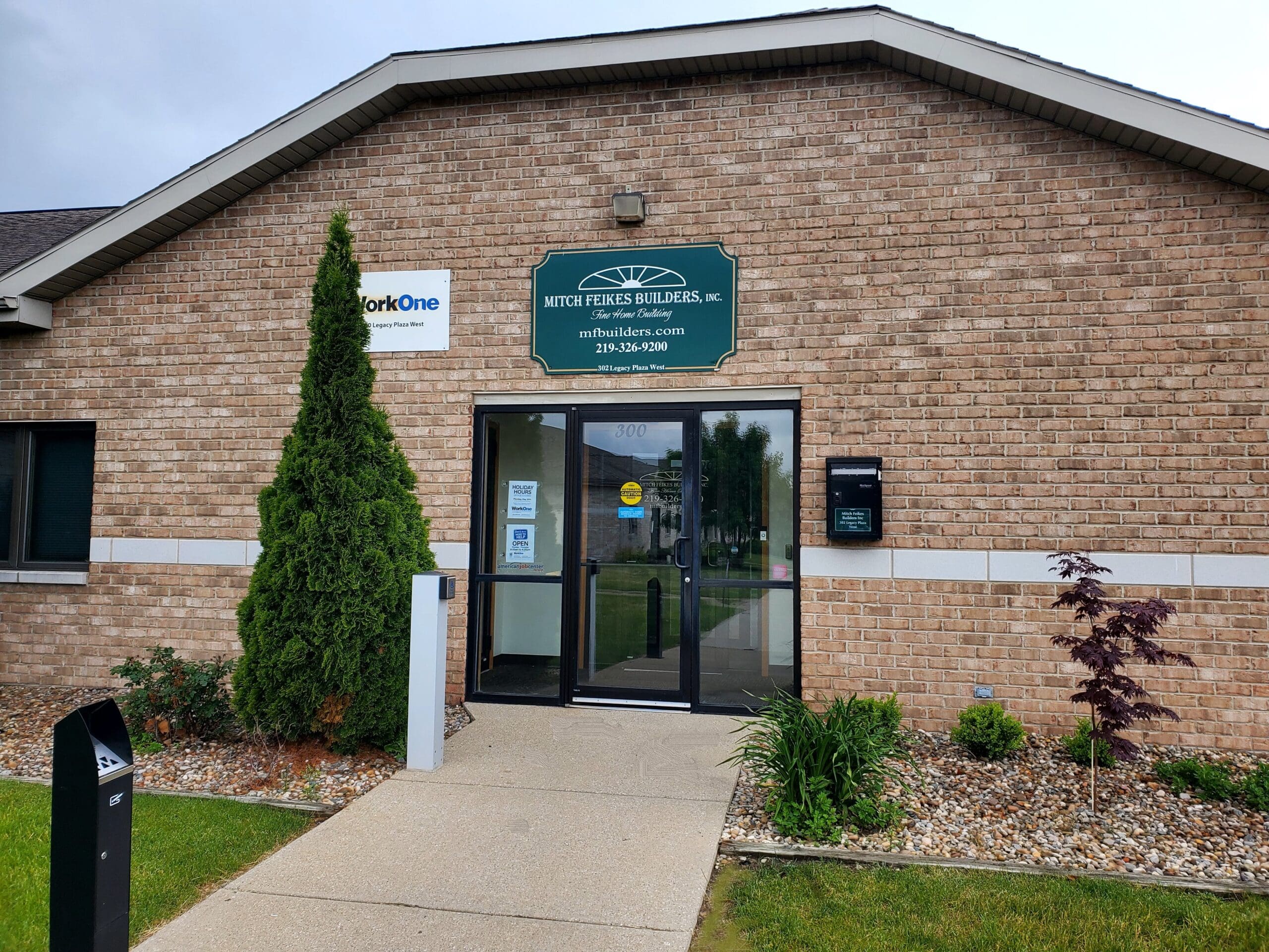 Front entrance of 304 Legacy Plaza West, a brick office building in Sagamore Business Center, La Porte, Indiana