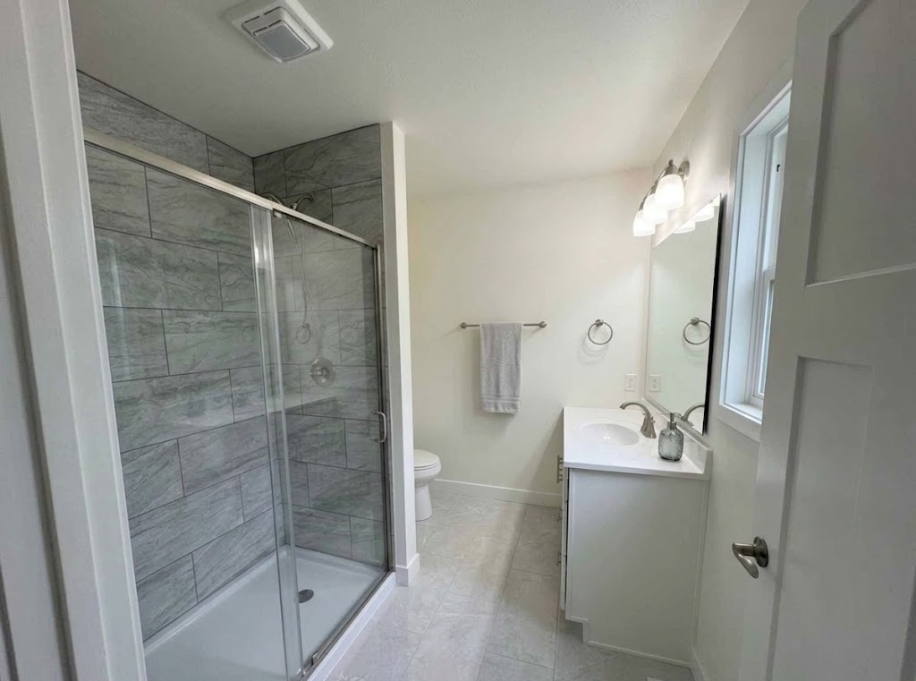 Primary bathroom with walk-in glass shower at 74 Prince William Court in Whispering Meadows