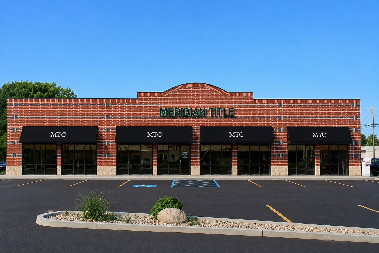 Meridian Title office building with brick facade, black awnings, and parking lot, a commercial project by MFB